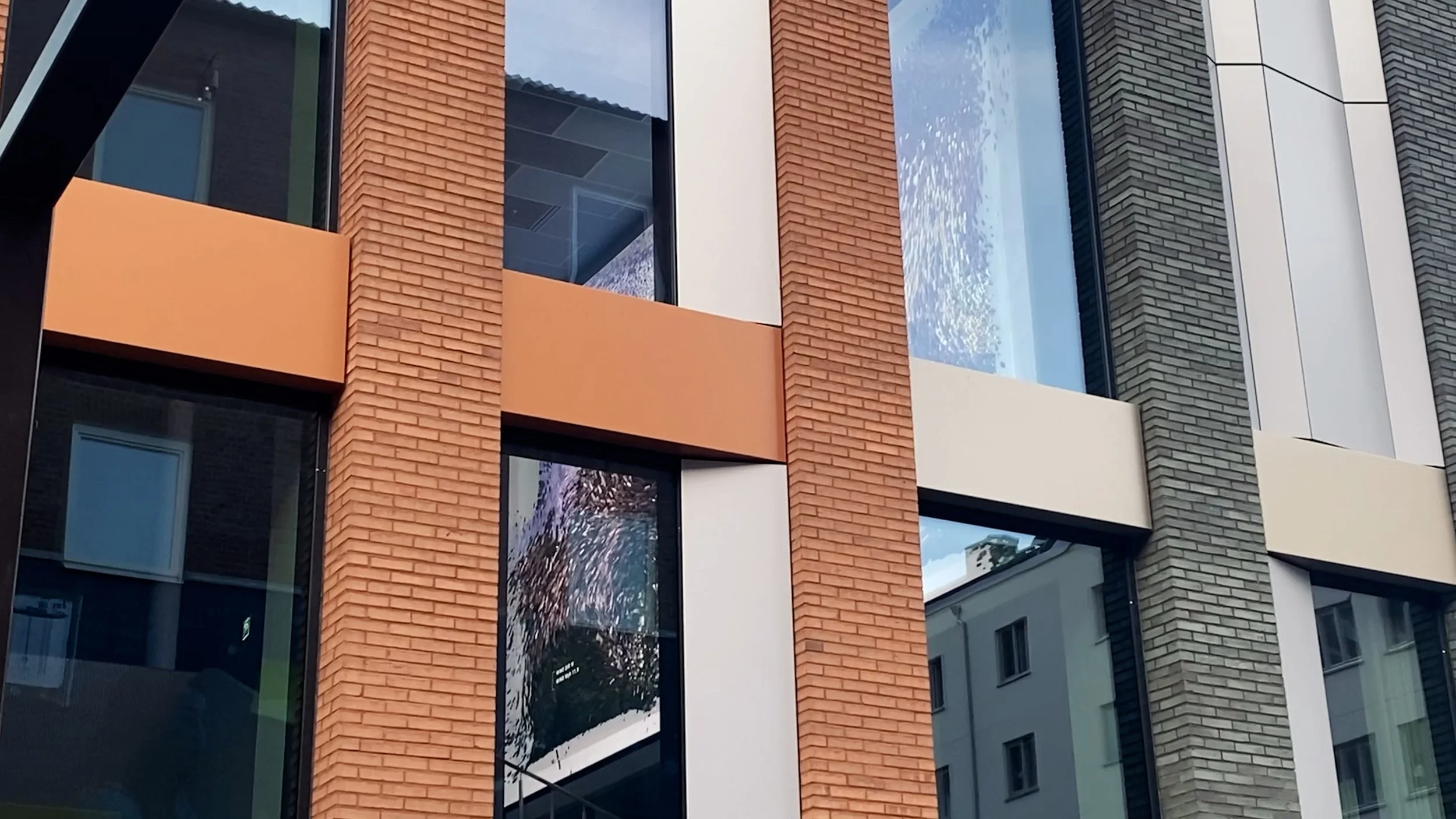 Building exterior showing installation visible through windows