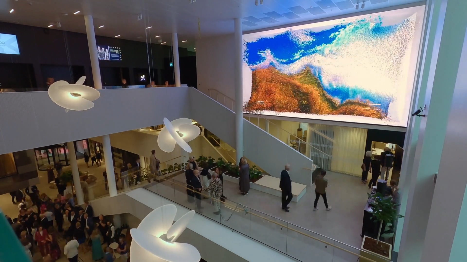 Moments in Time, permanent data sculpture by Phenomena Labs at Science Park Towers, Jonkoping, Sweden. Atrium crowd viewing Dreams of Nature chapter